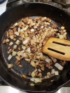 cooking liver and onions in a cast iron pan