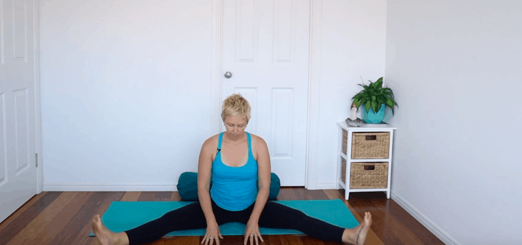 Fertility yoga pose:  Seated wide-Leg Forward Fold to open pelvis and groin, and increase circulation to sexual organs for improved fertility.