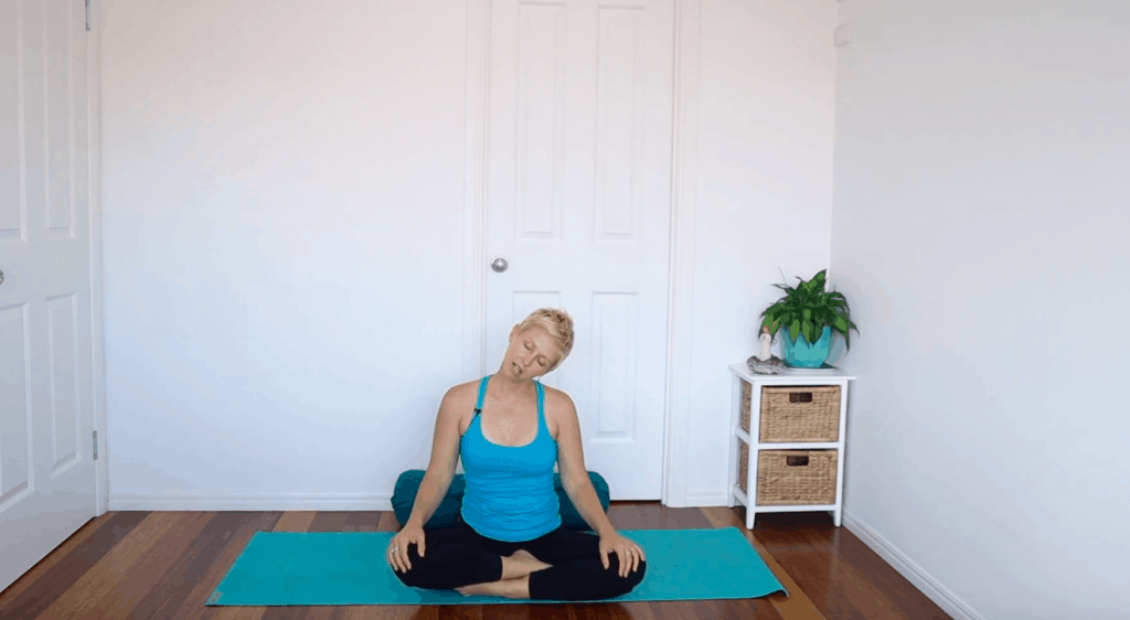 Fertility yoga pose:  Seated Neck Stretch to release stress and tension stored in the neck and shoulders for fertility 