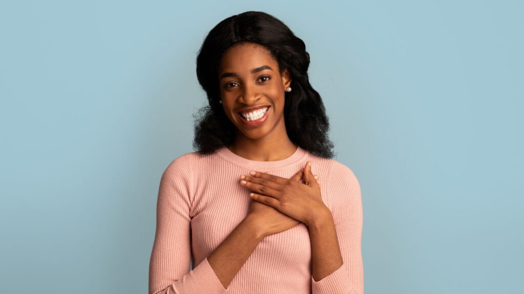 The Gratitude Practice That Helped Me Get Pregnant (three times!)- Woman Looking Happy and Grateful