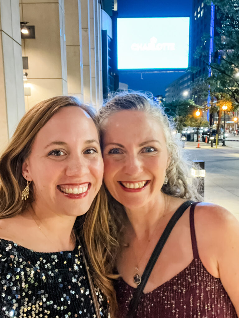 close up of two women smiling at the camera at Beautycounter LEAD conference; what does a Beautycounter consultant do, Anna Rapp 